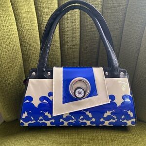 Michique Handbag. Very good condition. Blue and cream with red satin interior.